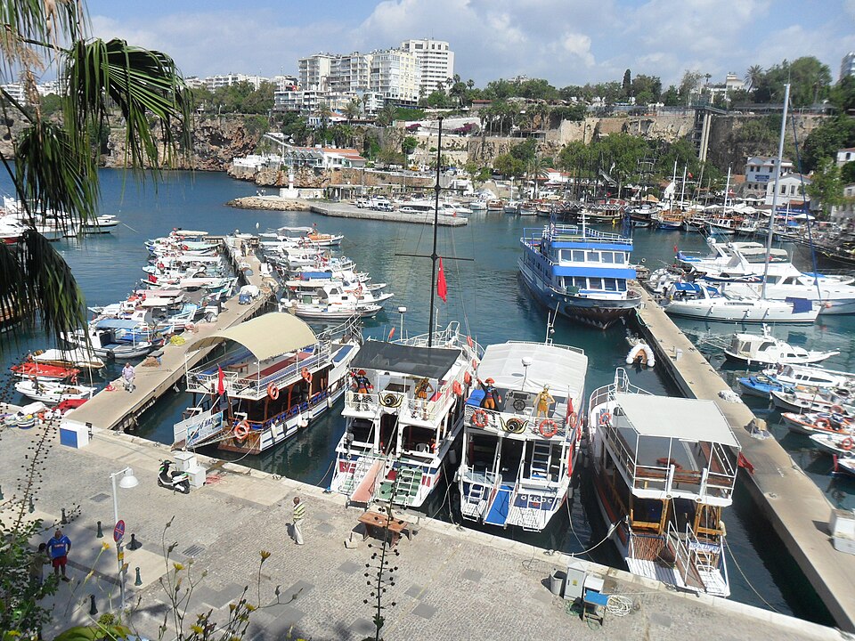 Boats and the historic harbour of Antalya, Türkiye